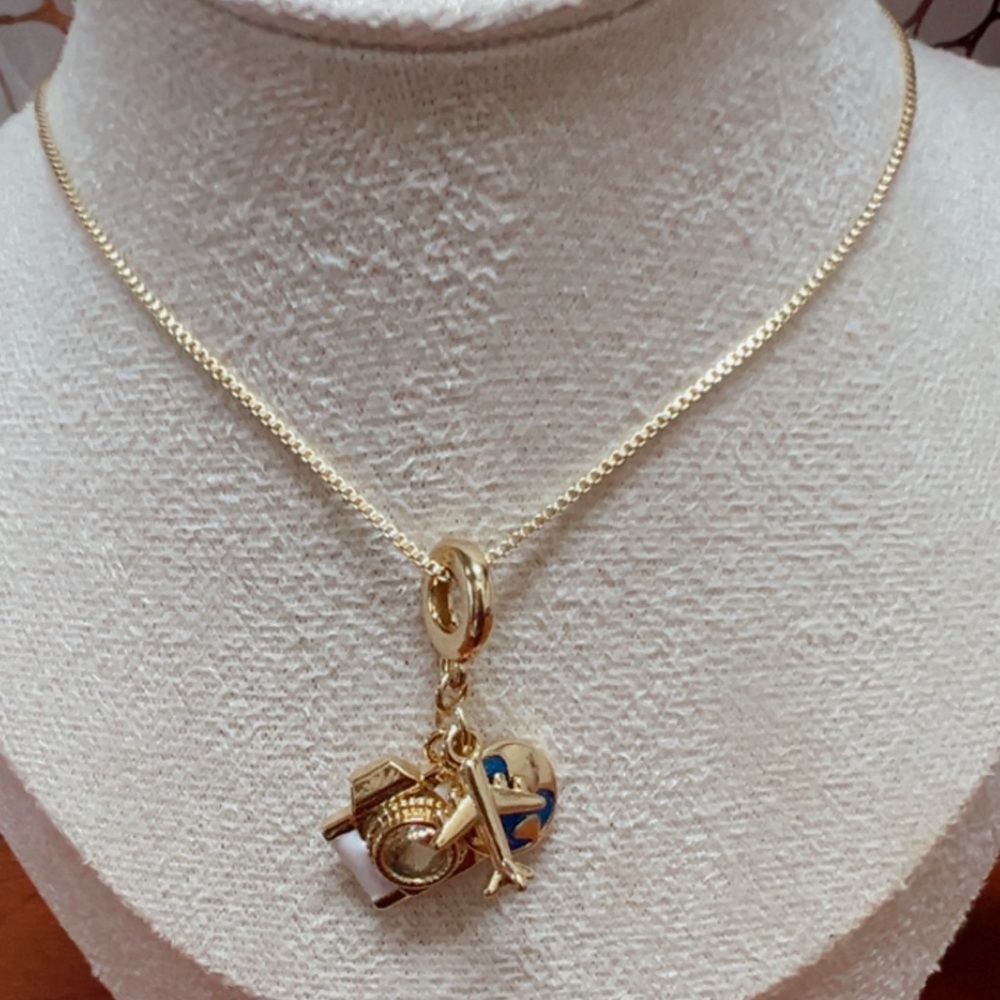 Golden chain with three pendants has a waterproof 18k gold plating.